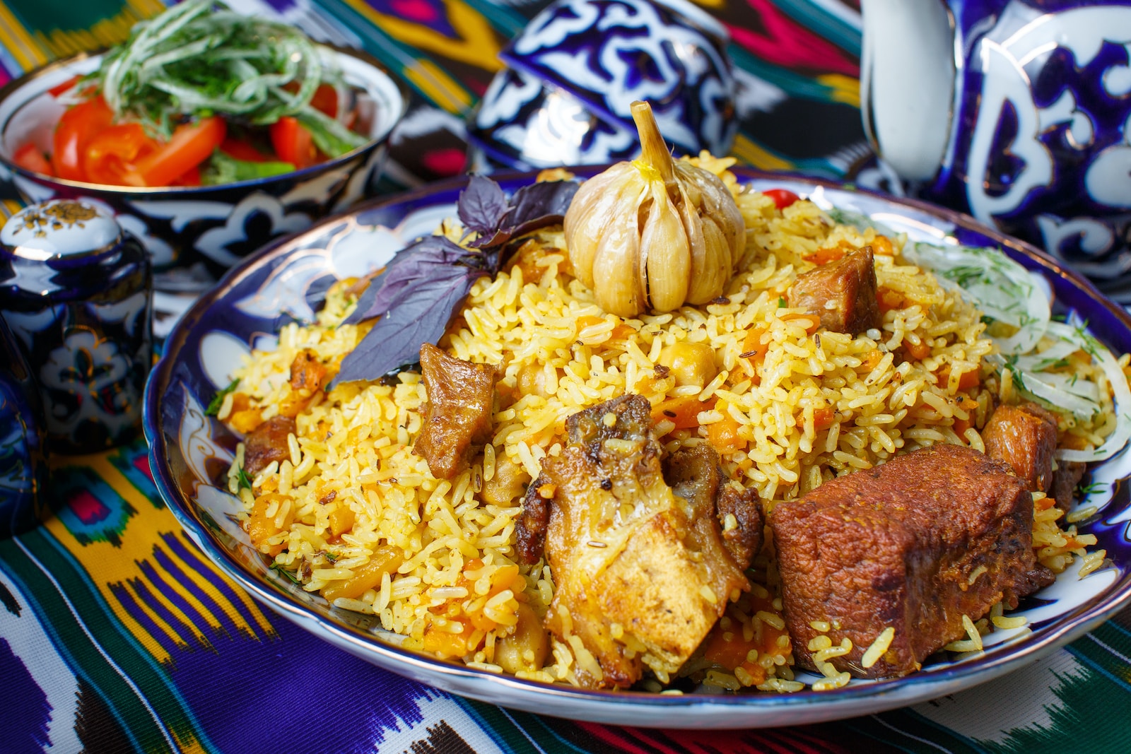 a plate of rice with meat and vegetables